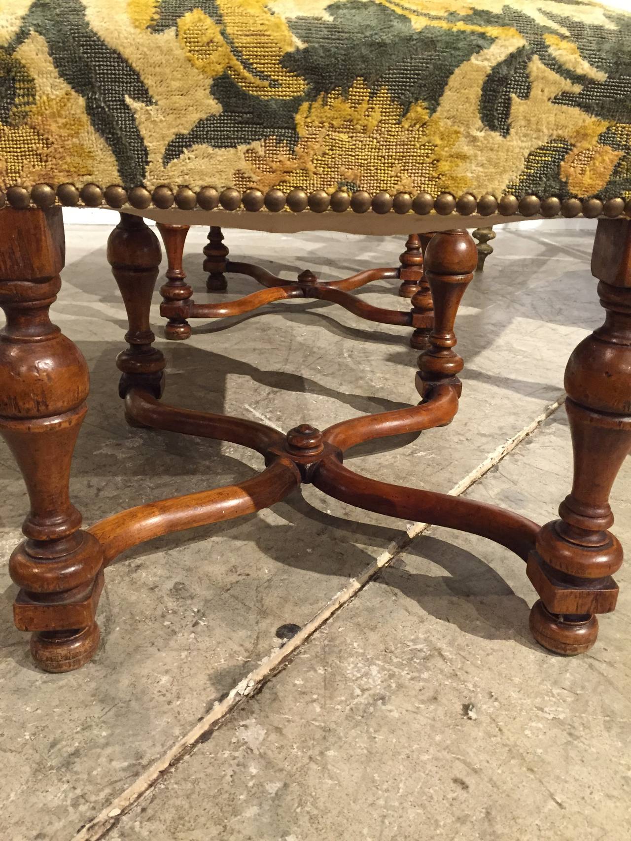 Louis XIII Style

This beautiful pair of antique French Louis XIII style tabourets (stools) date to the late 1800’s.  The baluster shaped legs and X-shaped stretchers are in walnut wood. The brocade upholstery has been added more recently and is