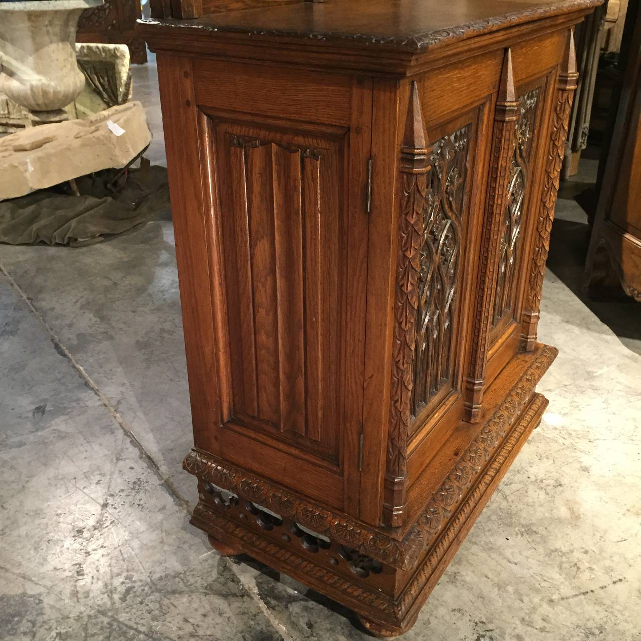 This versatile antique French Neo-Gothic cabinet, with its narrow width and depth has been carved from French Oak and is able to fit into most small spaces.  It can be used at the end of a hallway as a focal point; it could be used for wine or