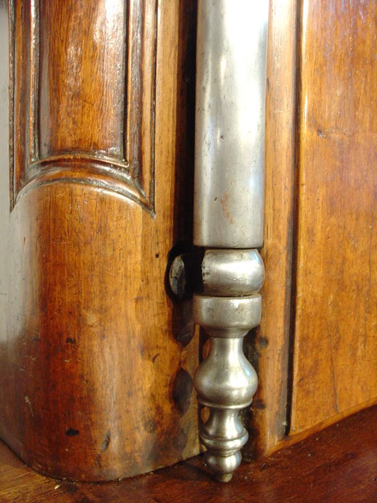 This rare and magnificent 18th C. French Walnut Wood Buffet a Deux Corps was most likely originally part of a boiserie or walnut paneled room from an exquisite and elegant property in the South of France. In antique French boiserie, most large