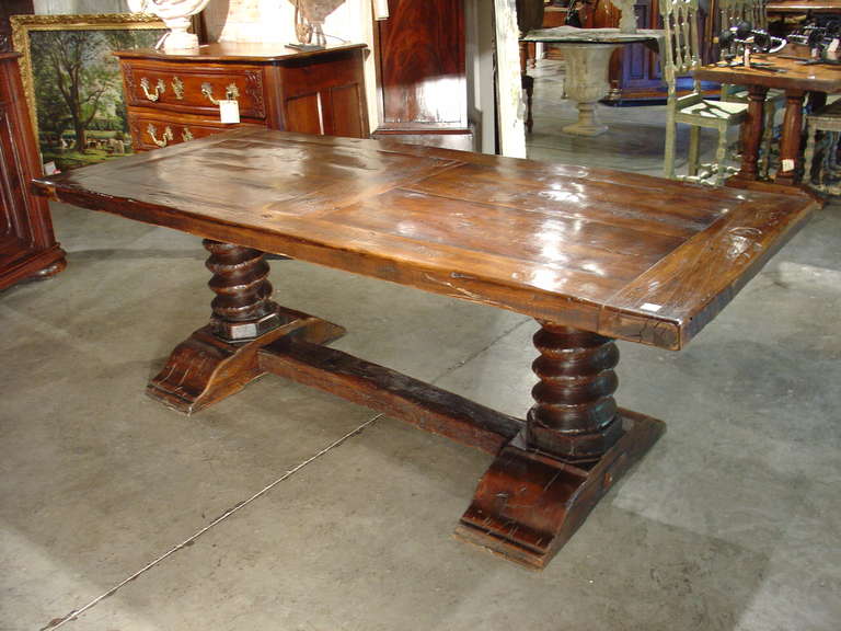 This unique tables' bases were constructed from a pre-Industrial French 18th century wooden wine press. These would have been the large screws that raise and lower the mechanism to press wine grapes. French wine makers first started using large
