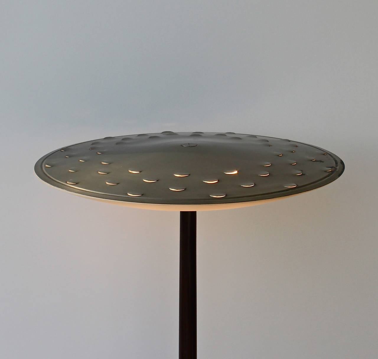 Rare floor lamp in wood and oxidised nickelled brass with a sanded glass dish by Max Ingrand for Fontana Arte. Metal diffuser with semi-circular cuts allowing the light to shine through.
As far as we know this model no 2143 has not been seen on the