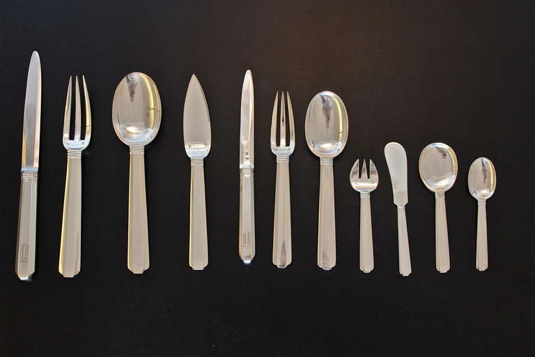 Extensive art deco silver cutlery set in the 'Bayonne' pattern by the renowned Art Deco silversmith Jean-Emile Puiforcat. 
The 195 piece set is for 12 people and comprises 24 Dinner Knives,24 Dinner Forks,12 Dinner Spoons,15 Entree/Desert Knives,12
