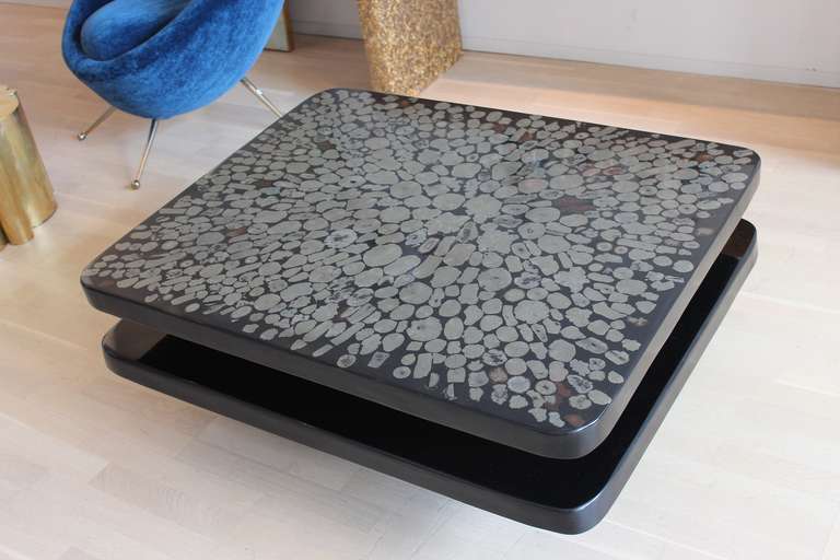 Double plateau table in resin inset with marcasites by Etienne Allemeersch.

Etienne Allemeersch was the head artisan who worked for Ado Chale in the 1970s and executed Chales resin and semi-precious stone topped tables.