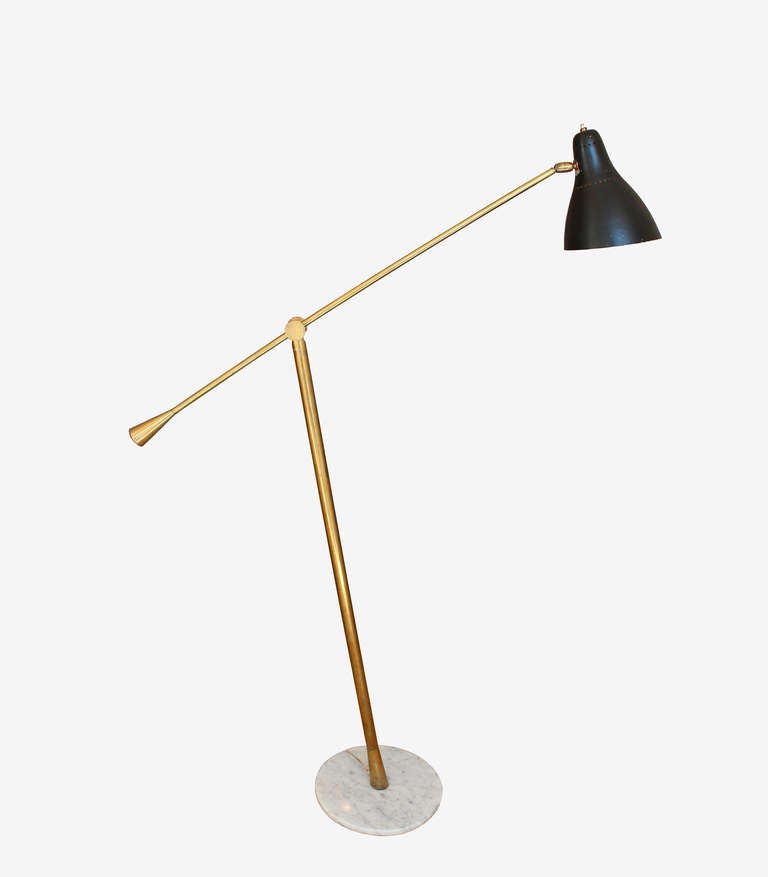 Brass adjustable single arm floor lamp with black lacquered metal shade and marble base by Stilnovo.