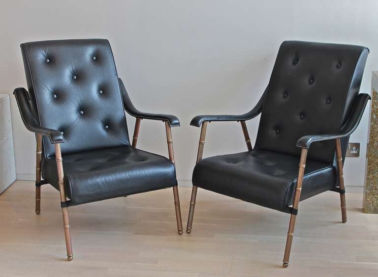 Pair of armchairs in buttoned and stitched leather with faux bamboo brass legs by Jacques Adnet. This chair model is documented in 'Jacques Adnet' - Alain- Rene Hardy/Gaelle Millet,  Les Editions de L'Amateur pg 211
