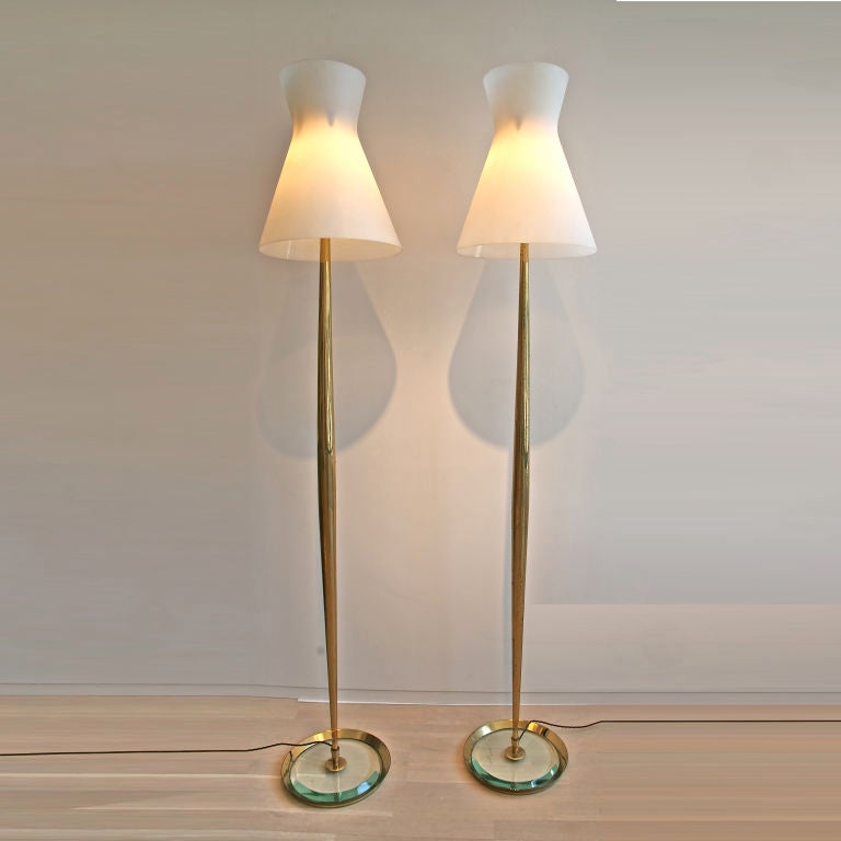 Rare pair of standing lamps by Max Ingrand for Fontana Arte.<br />
 Brass tapering stems with a glass base and sanded glass shades.<br />
Model no. 2156