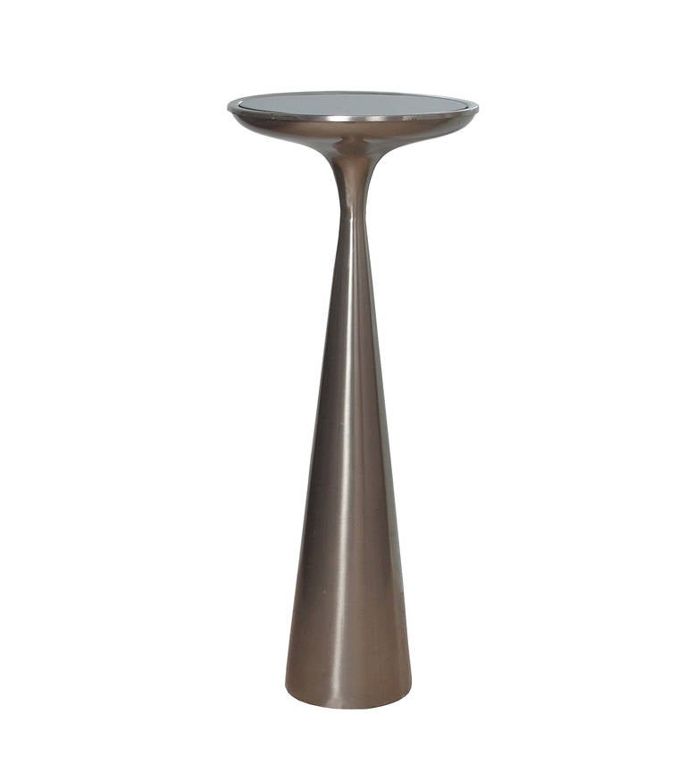 Rare table in nickelled brass with glass top by Max Ingrand for Fontana Arte.
Usually produced in brass this one in nickel was probably a special order.