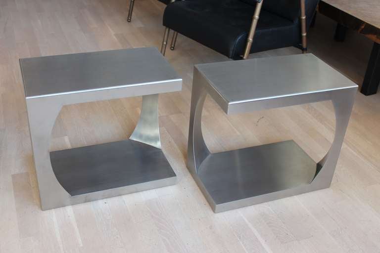 Pair of stainless steel side tables by Van Heusden. These tables were retailed by Maison Jansen, Paris.