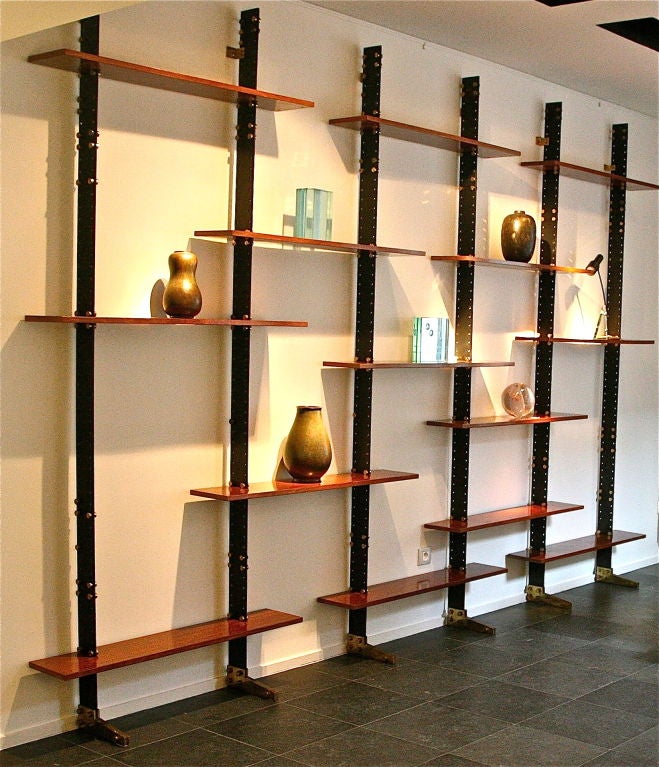 Rare wall mounted library by Ignazio Gardella edited by Azucena. Black lacquered metal struts with brazilian rosewood shelves and oversized brass screws. Shelves can be placed in different orders and there are also two larger shelves not shown.