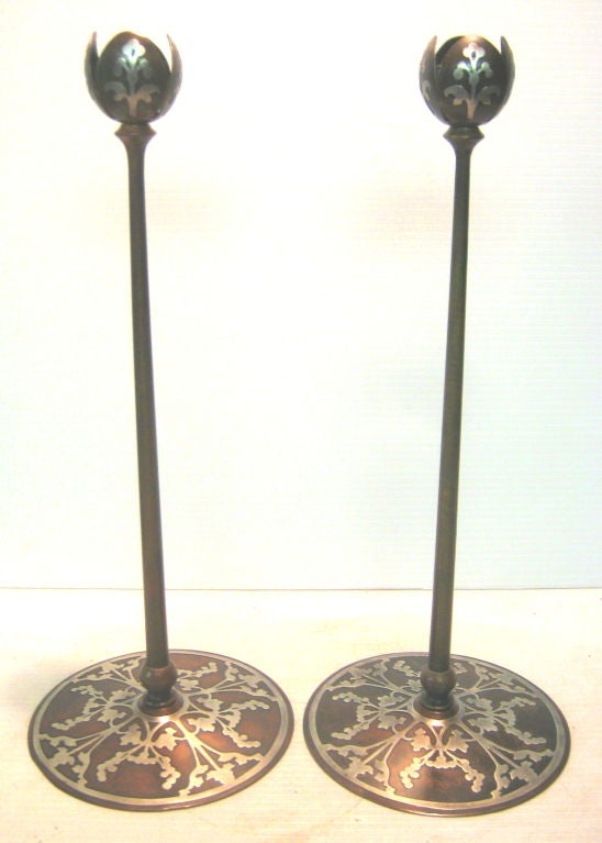 Tall pair of Tiffany-style candlesticks with stylized organic sterling overlay on base and all four leaves of bobeche.