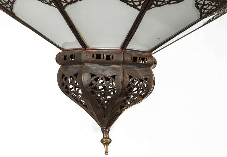 Moroccan Hanging Lighted Star Pendant
Metal frame and frosted glass with delicate filigree metal work on this hanging star pendant. 
Rewired can take up to 100 Watt bulb.
Size of the star shade is 23