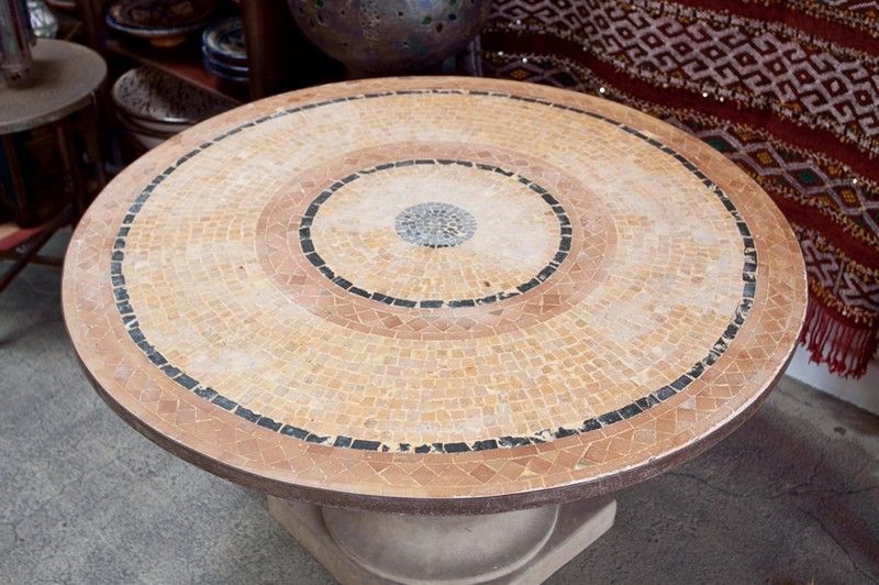 A inlaid stone mosaic tile top table with a carved cast stone base.
Handcrafted in Morocco could be use indoor or outdoor as a patio dining table or garden decor.


Moorish, Spanish, African, Islamic, Arabian, Middle Eastern, Egyptian, Syrian