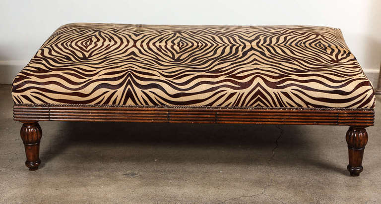 Coffee Table Ottoman in Leather Hide in faux zebra design.
Ottoman Coffee table with 2 drawers newly reupholstered with leather faux hide Zebra. Great accent piece. 19th century wooden frame.