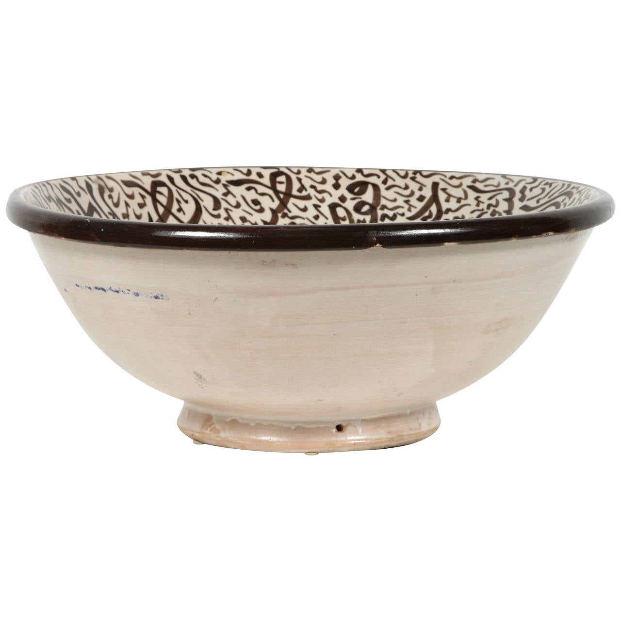 Large Moroccan ceramic bowl with Arabic calligraphy.
Handcrafted ceramic from Fez Morocco, hand-painted with Arabic writing.
This kind of Art Writing looks calligraphic is called Lettrism, it is a form of art that uses letters that are not supposed