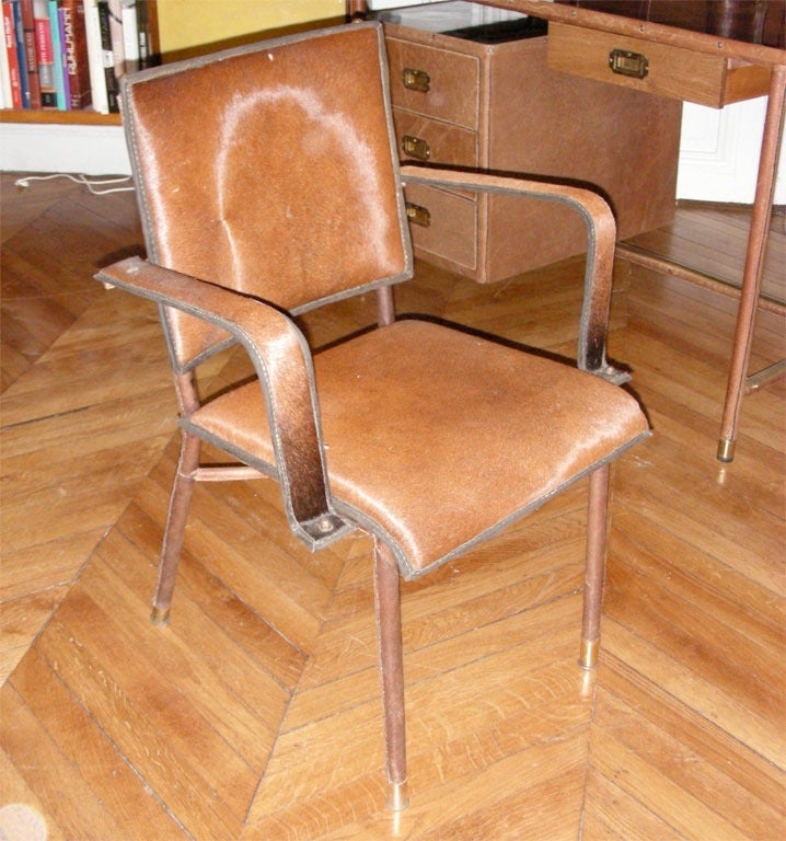 Very interesting desk with bin, lamp, and papers and pens rack.
Chair covered with stitched leather and foal skin.
No chair included