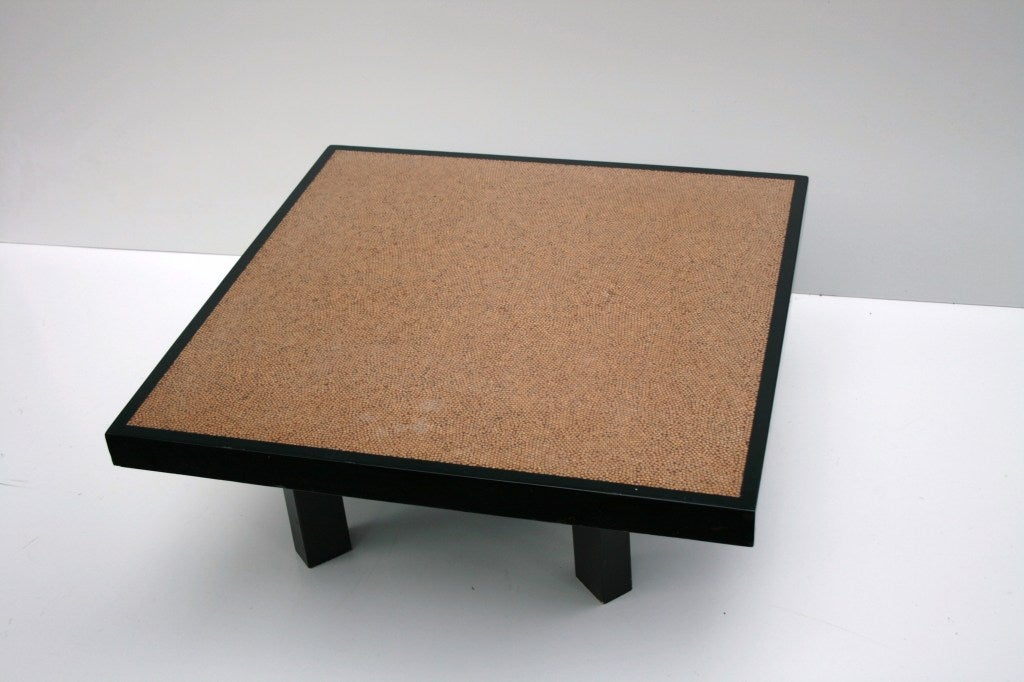 Surprising coffee table designed by Ado Chale. 
The legs are wood and the top is made of polished peppercorns.