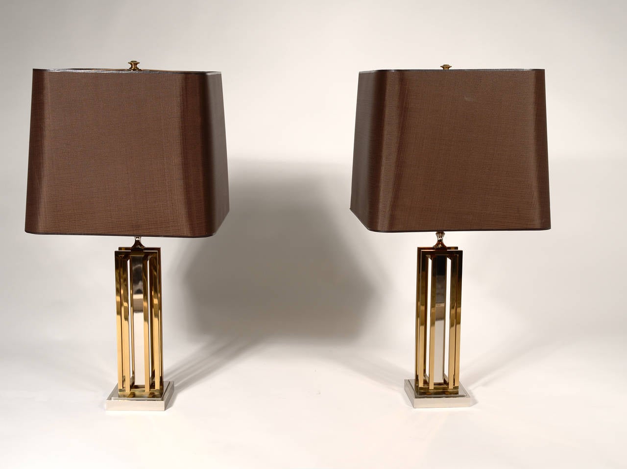 Pair of lamps by Willy Daro brass and chrome, perfect condition and original shade.