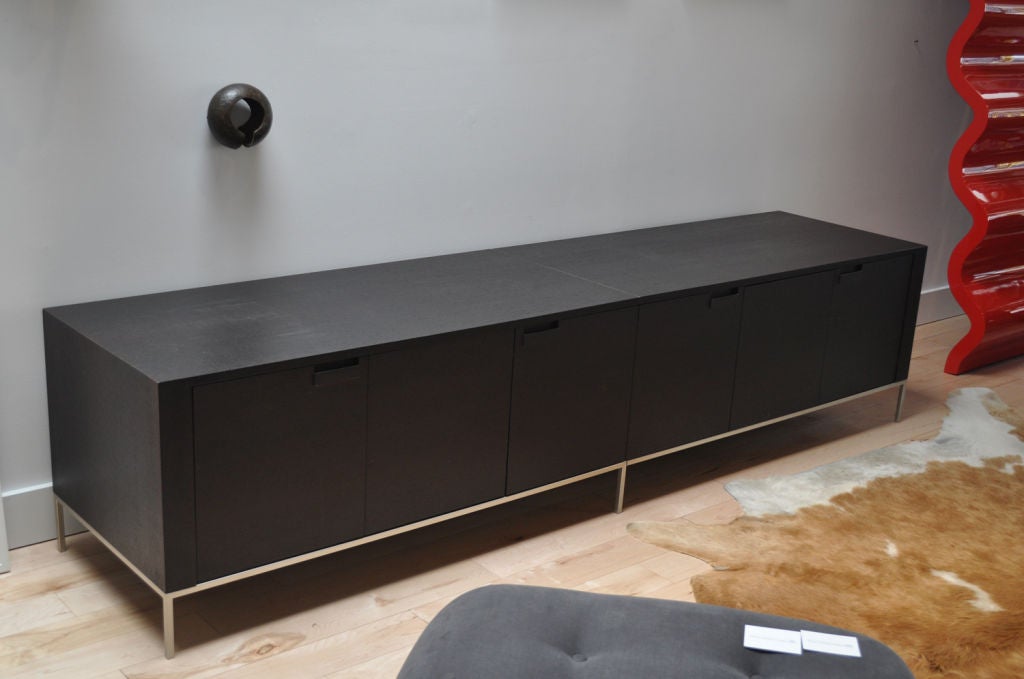 Ebonized oak credenza by Antonio Citterio for B&B Italia. The unit  contains four compartments. Two sliding doors and two doors that pull open.