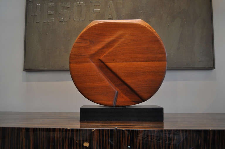 Beautiful solid walnut abstract modern sculpture on a black base.