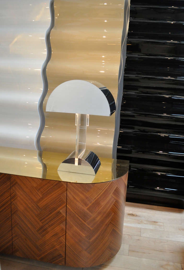 Exquisite simple geometric mid century modern polished metal lamp by George Kovacs.
