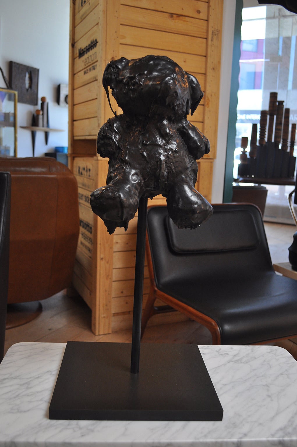 This whimsically morbid cast bronze sculpture is by Los Angeles artist Mattia Biagi. It emerged from a previous series of sculptures in which Biaggi immersed found teddybears in tar. The sculpture, part of an open edition, is mounted on a metal base.