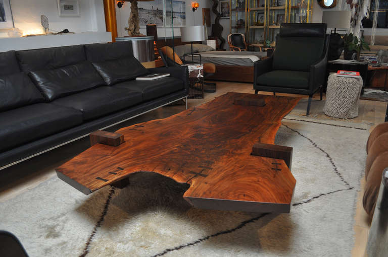 Commissions available. Please contact showroom. 

Exquisite unique larger scale solid walnut slab coffee table.  For the past 30 years R. Patterson has been creating timeless pieces.Today he continues to search for the most elegant and refined