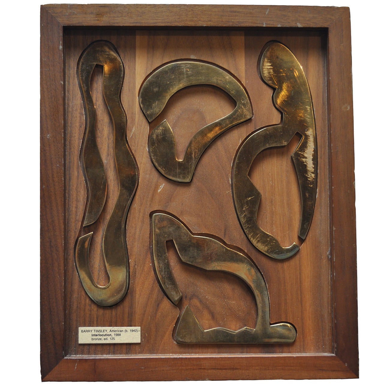 "Interlocution" bronze puzzle in display case