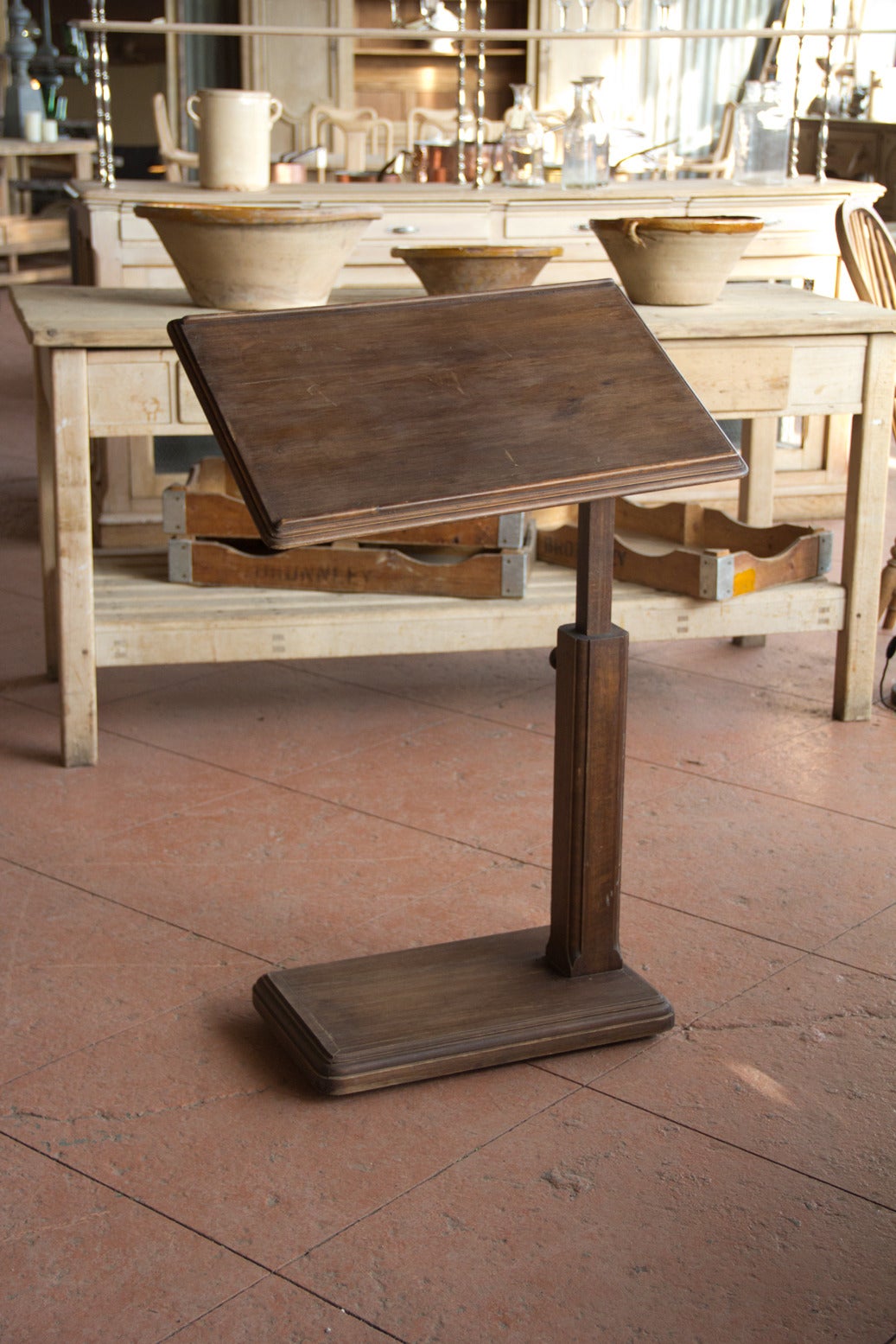 Antique lectern on wheels with its original hardware.