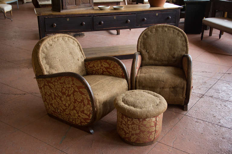 Fabulous pair of Belgian Art Deco club chairs with wood trim arms and matching pouf. Ready for upholstering or leave 