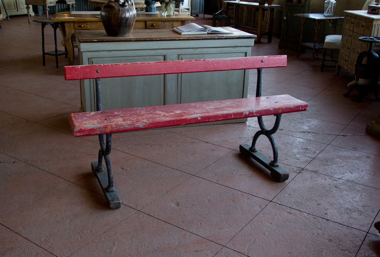 Lovely antique English tram bench with Regency style iron legs, hefty wooden seat and lots of chippy paint.

We currently have 2 available.
