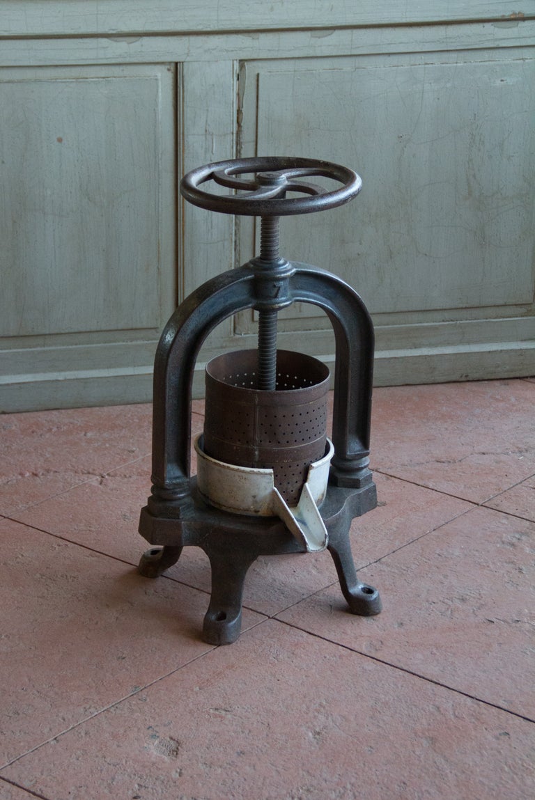 Antique French cast iron walnut oil press ca. 1870. Very unusual item with a great early industrial look.