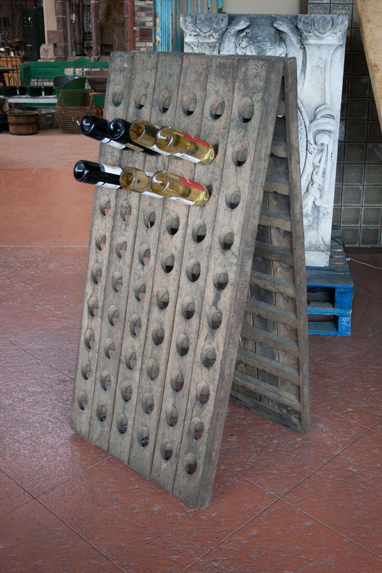 Lovely 120 bottle French oak A-frame riddling rack (pupitre), from the Champagne region.

In the 19th century Madame Nicole-Barbe Clicquot, head of the luxury brand of champagne, Veuve Clicquot Ponsardin, invented the riddling rack or pupitre out