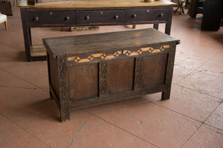 Rare English Jacobean oak 3 panel coffer inlaid with holly and bog wood, the stiles carved with scroll motifs and finished with mat punching,