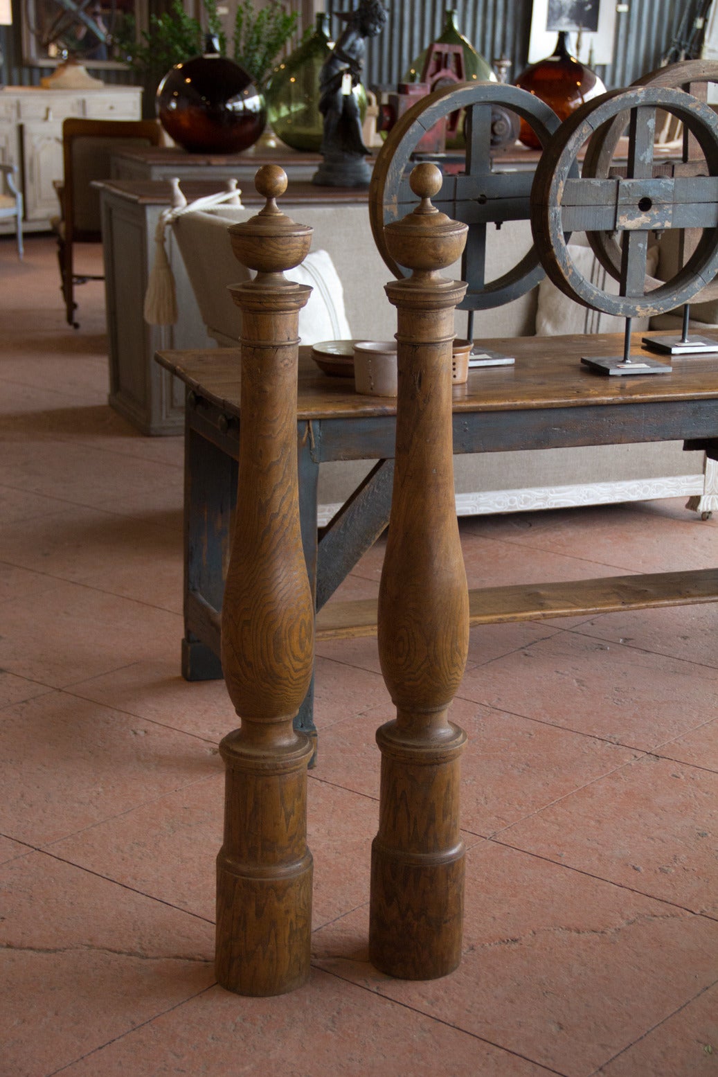 Pair of antique turned hardwood posts with ball finials.