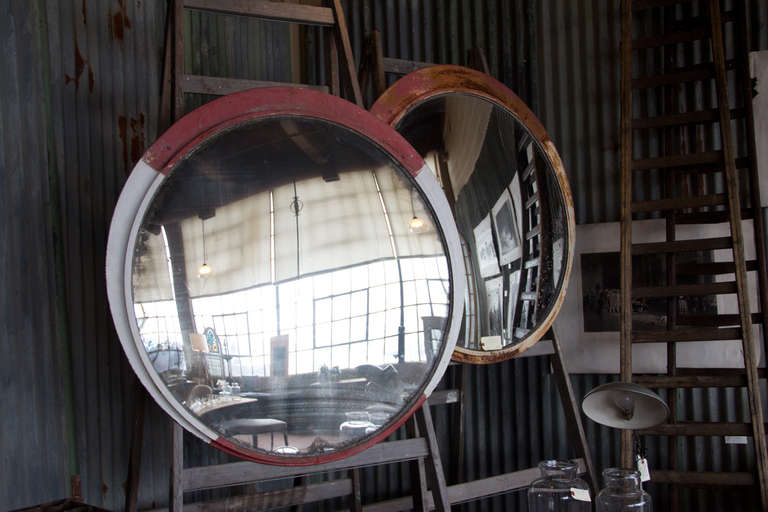 Very large vintage industrial convex mirror encased in metal. It has its original glass with just the right amount of aging.

