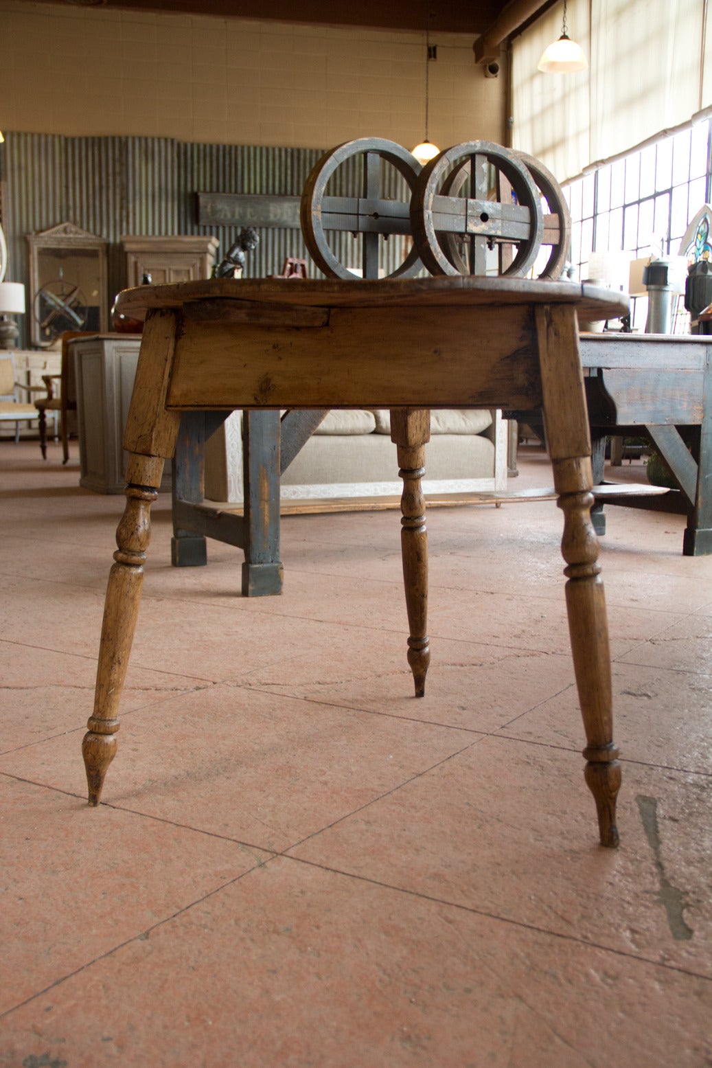 Beautiful patina on this antique English pine cricket table with turned legs. 

Cricket tables always have three legs, so they were stabile when placed outside on uneven ground at cricket matches.