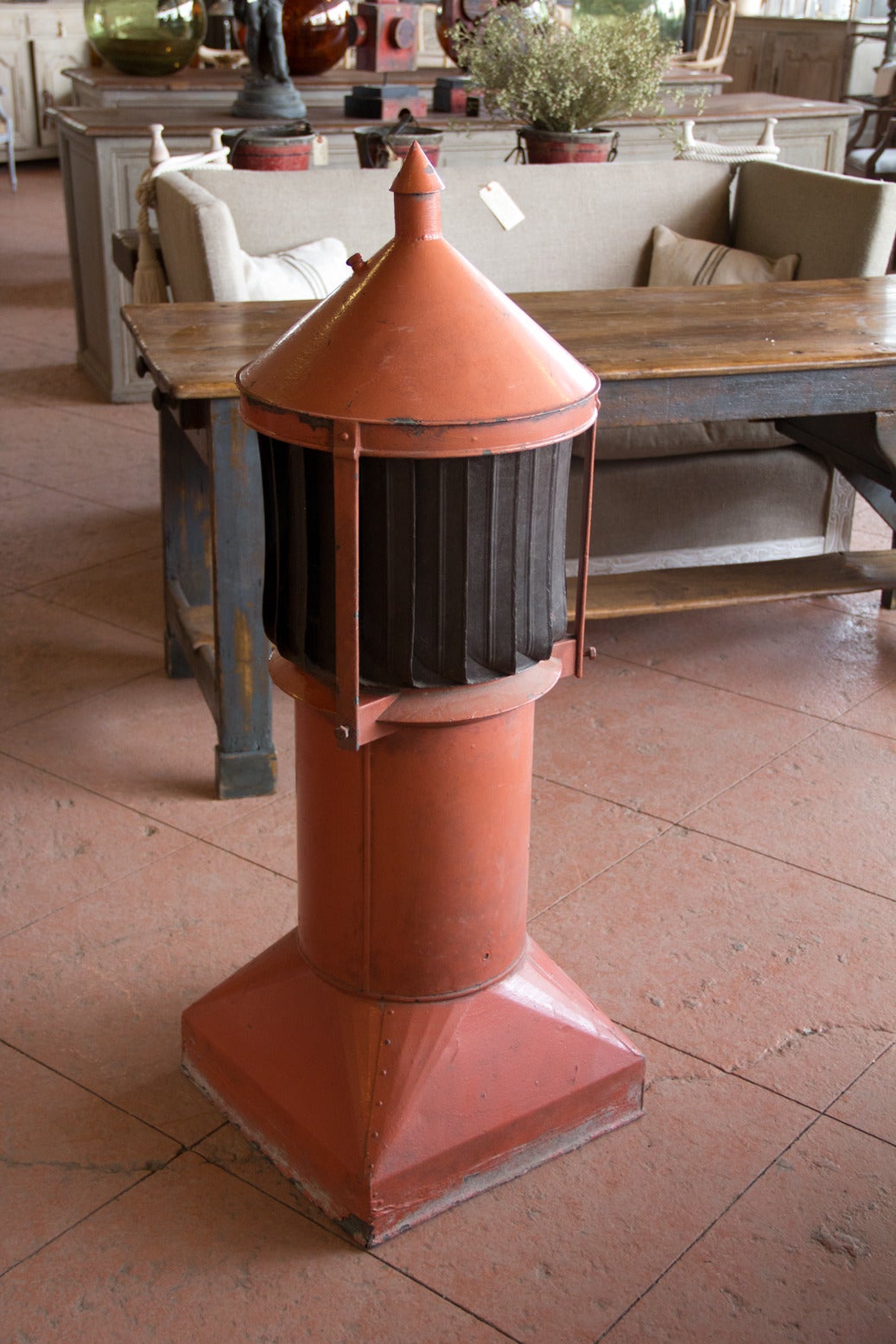 This is a wonderful vintage riveted zinc chimney cowl. It spins gently in the wind and would make a lovely garden accent. It is one of a rare collection that we currently have. If you would like to provide us with your email address, we would be