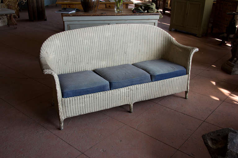 An  original Lloyd Loom 3 seater settee with its pre-1930 sprung seats. The woven fabric and furniture was invented by Marshall Burns Lloyd a 100 years ago. It is associated with the Art Deco movement and the ever so chic luxury ocean liners of its