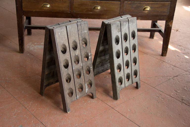 Lovely pair table top size A frame wine racks made from original antique French oak riddling rack (pupitre), from the Champagne region. Each rack holds 24 bottles.

 In the 19th century Madame Nicole-Barbe Clicquot, head of the luxury brand of