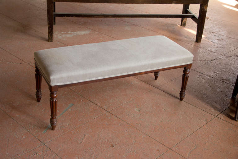 Beautiful French bench with lovely turned legs and newly upholstered in linen.