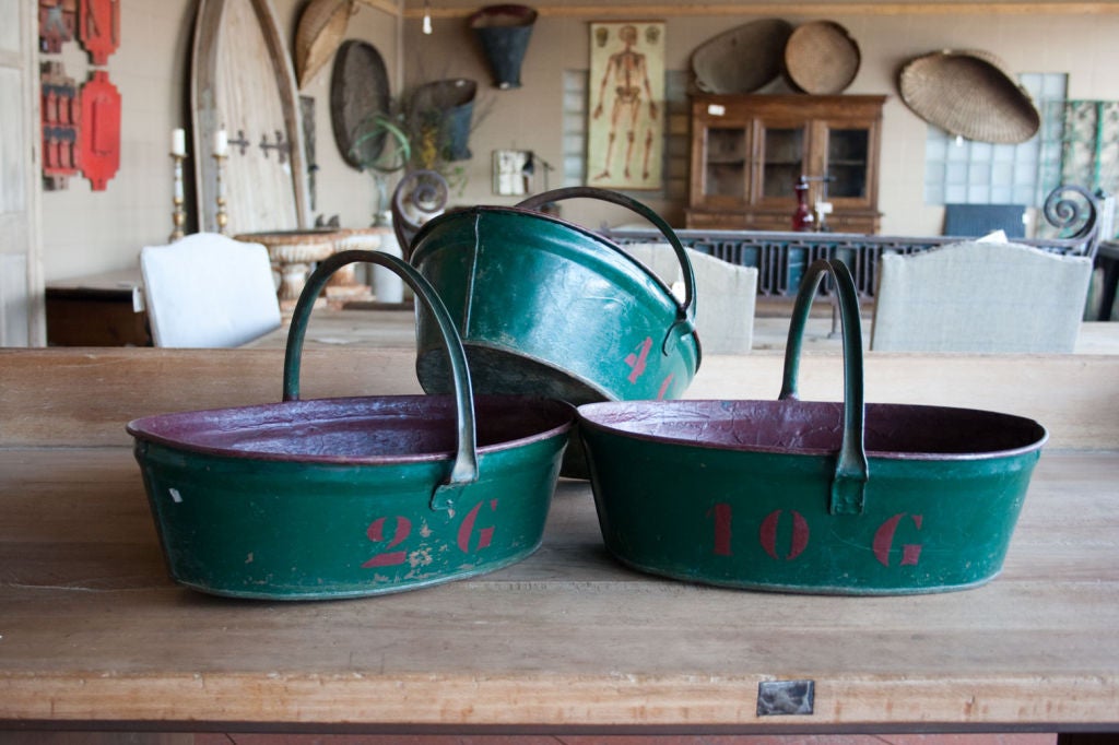 Set of 3 vintage French tole grape pickers' trug - each numbered to identify picker.  Original burgundy and green paint.<br />
<br />
2 other sets available