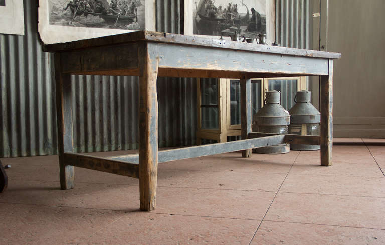 Substantial antique French industrial work table with its original grey/blue paint.  Makes a great kitchen island.