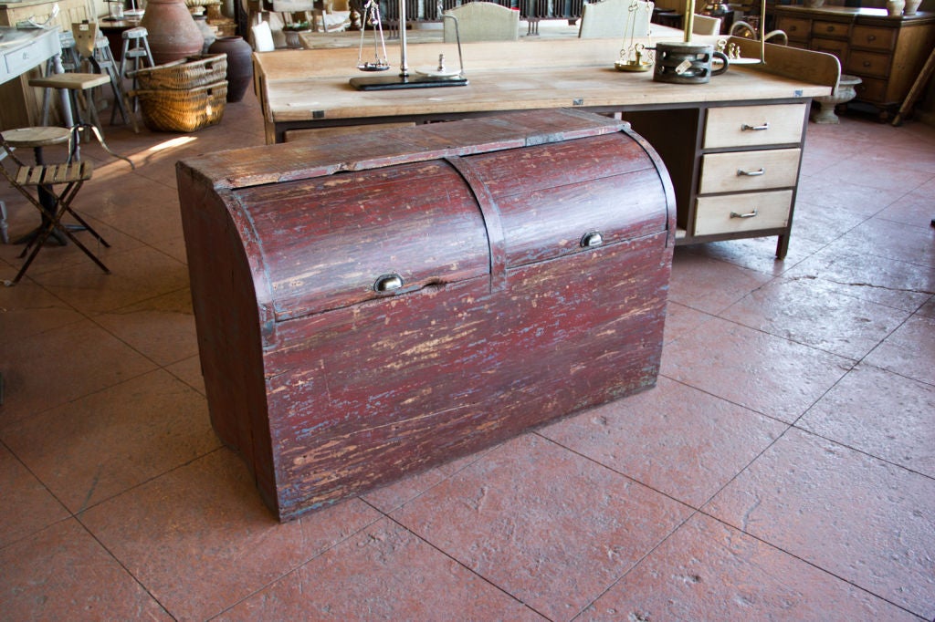 This is a wonderful antique roll top grain bin from Argentina.  The perfect place to throw the kids toques and mitts!