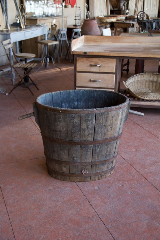 Antique French oak grape barrel with its original oak peg handles. Would make a wonderful basket for you logs!<br />
We have 5 available