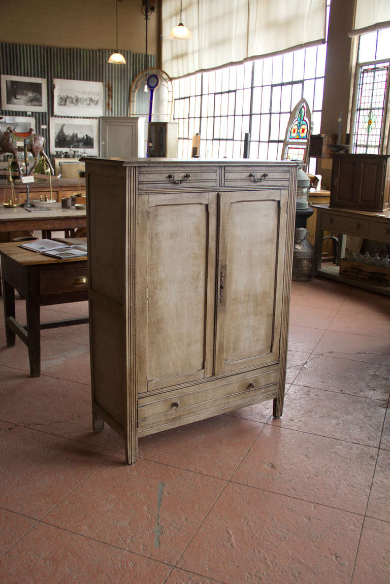 Vintage French painted linen cupboard. It has two drawers above a central cupboard, there is also a further, full-width drawer below. It is hand painted 