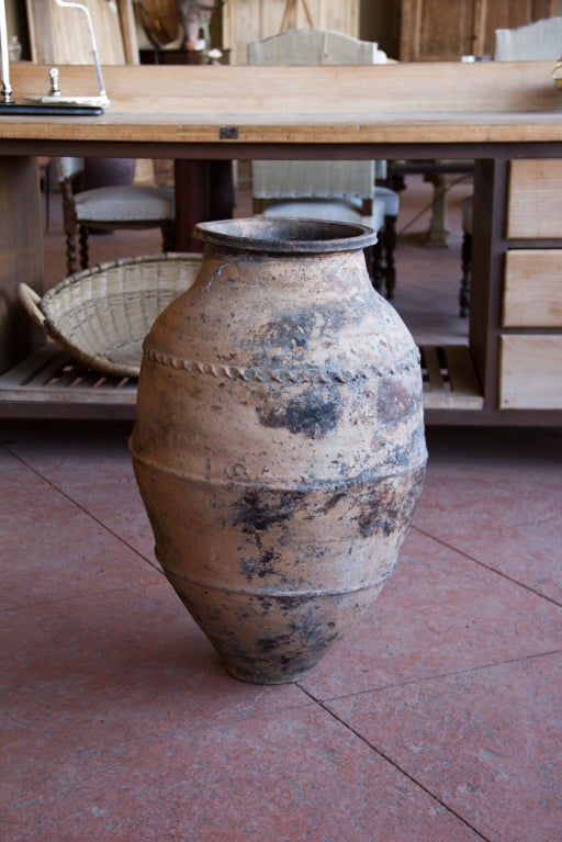 Lovely Turkish antique terra cotta storage pot.  Nice decorative pattern around the pot.