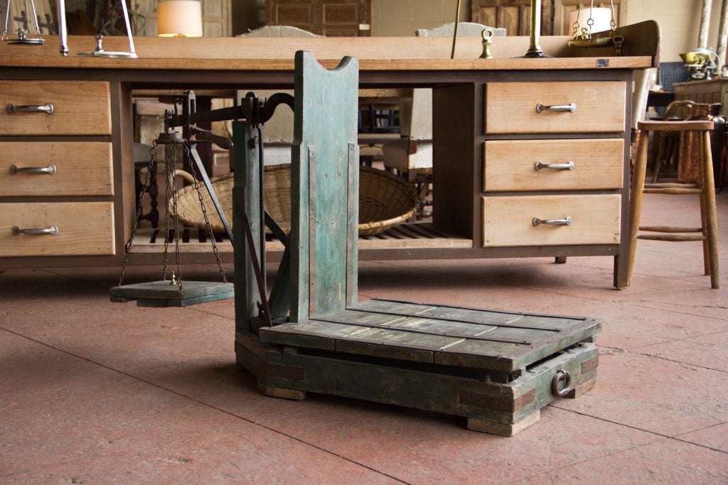 Rare wood and strap iron weigh scale from the commune of Lunville, Meurthe et Moselle, in the Lorraine region. Gorgeous ironwork and its original green paint makes this a great stand alone piece.