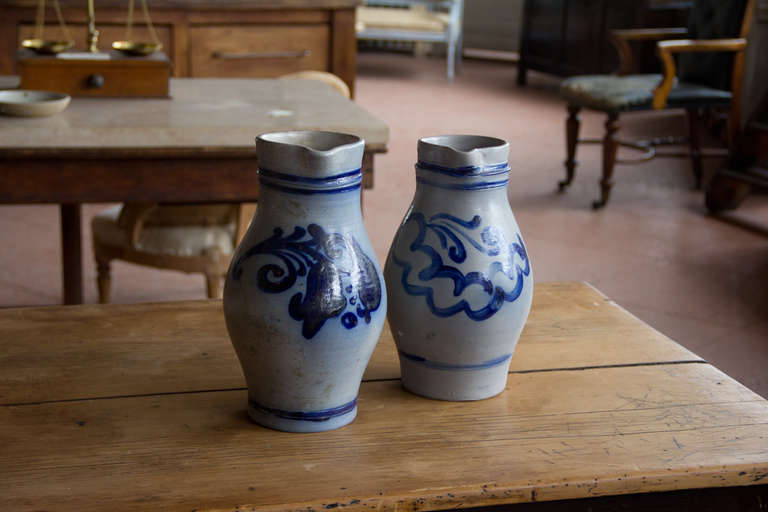 Pair vintage salt glazed flow blue Dutch jugs.