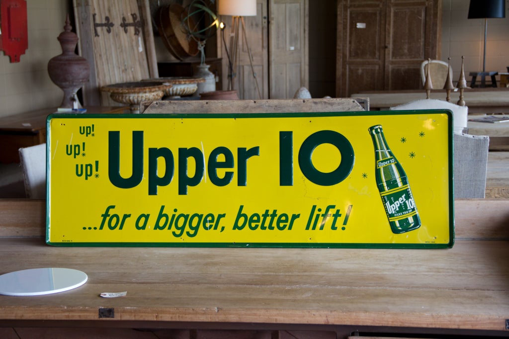 Great metal sign with embossed green lettering on a yellow background. Marked along bottom 3510 upper 10. Believed to have been used as advertising sign in the 1950s.