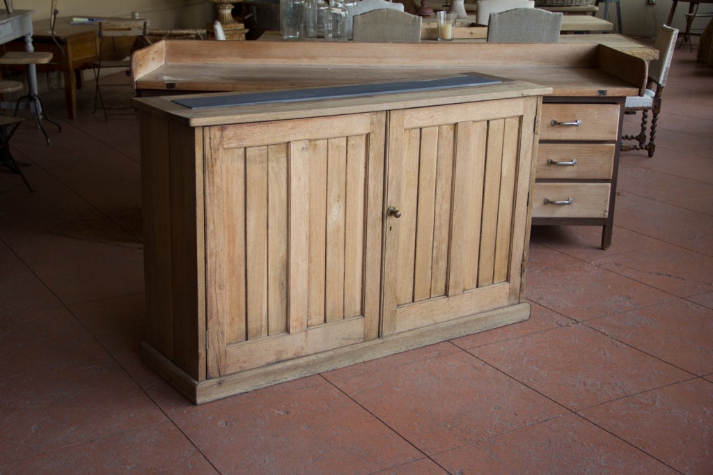 Rare find - a 19th century Victorian tongue and groove oak cupboard, reclaimed from an English school. We have inserted 19th century Welsh slate in the channel. Wonderful size and quality makes this a perfect furniture piece for any room.